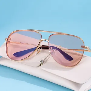 Classic gold metal aviator sunglasses with gradient lenses and cream leather case