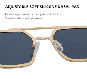 Detail of adjustable soft silicone nose pads on square vintage metal sunglasses