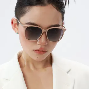 Detailed close-up of stylish square oversized sunglasses with chic beige frames and gradient lenses