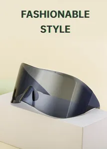 Detail of gray one-piece oversized cycling sunglasses on a minimalist white platform