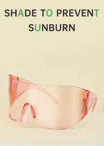 Detail view of pink semi-transparent wrap-around sports sunglasses on beige backdrop