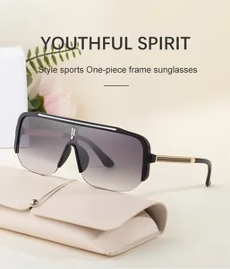 Close-up of sporty semi-rimless sunglasses with gold accents and beige leather case