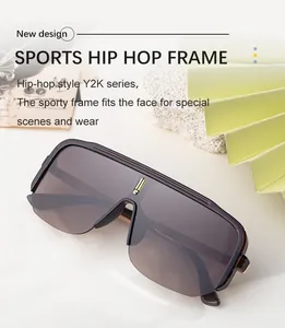 Detail of Y2K sporty shield sunglasses with semi-transparent frame and gold bridge accent