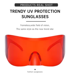 Detail view of red frameless shield sunglasses with UV protection and a wide field of vision