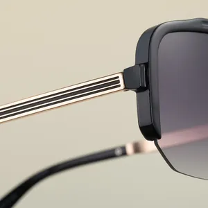 Detail of gold metal hinge and black frame on premium rimless cycling sunglasses