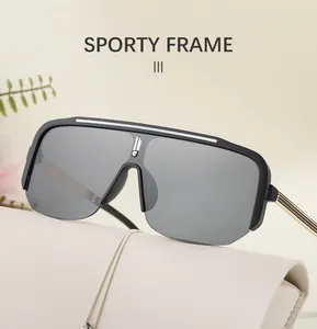 Detail of black sporty frame sunglasses with gold metal temples and modern single lens design