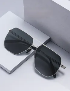 Detail of square polarized nylon sunglasses featuring a silver metal double bridge frame