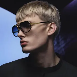 Close-up of square aviator sunglasses with gold metal frame and gradient blue lenses