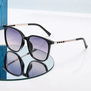 Women's square cat-eye sunglasses with purple gradient lenses and gold metal temples