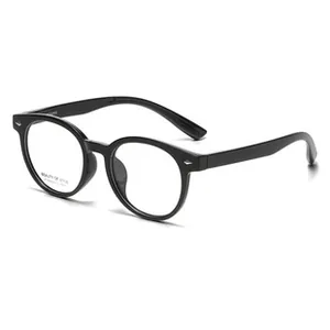 Detail of black retro round glasses frame with silver stud accents and clear lenses