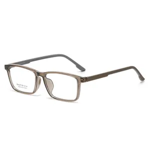 Detail view of transparent tea-colored square frames with matte grey temples and logo