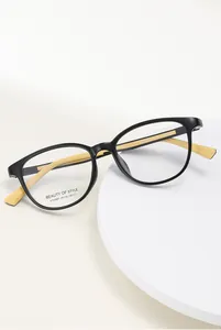 Detailed close-up of stylish square optical glasses frame with contrasting bicolor design