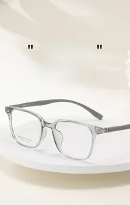 Macro shot of transparent grey square optical frames showing temple model specs