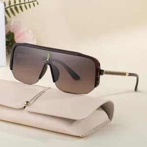 Fashionable oversized wrap-around sunglasses with brown gradient lenses and leather pouch