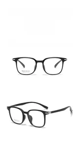 Close-up of bright black optical frame with silver accents and engraved brand details