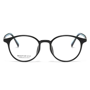 Montura de gafas redonda negra a la moda con patillas azul cielo y acabado pulido