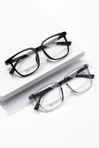 Detailed view of square optical frames in black and grey with model specs AT68633