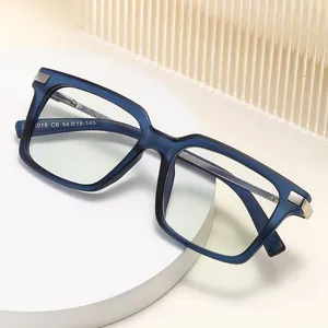 Navy blue square optical glasses with matte finish shown on minimalist geometric platform