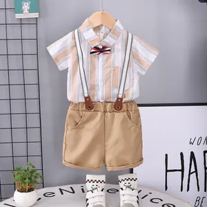 Boys summer outfit with striped short sleeve shirt, suspender shorts and bow tie set