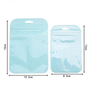 Detailed view of light blue iridescent resealable pouches in two different sizes