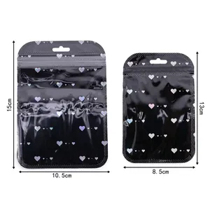Macro detail of black laser holographic heart patterns on resealable plastic bags