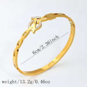 Elegant 18k gold plated stainless steel bangle with diamond logo and padlock charm