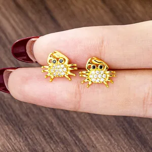 Exquisite gold-plated crab stud earrings with sparkling white zircons and black gemstone eyes