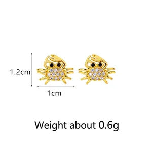 Elegant gold-tone crab stud earrings with pavé crystals measuring 1.2cm by 1cm