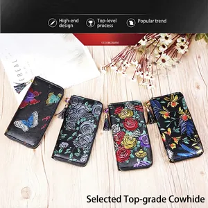 Long leather zip-around wallets with colorful floral embossing and decorative tassels