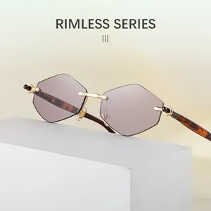 Macro detail of rimless hexagonal sunglasses with gradient lenses and tortoiseshell temples