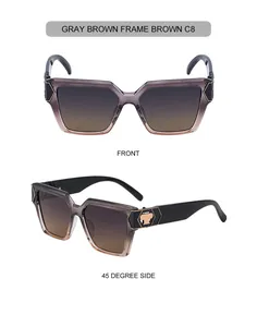 Detaillierte Vorder- und Seitenansicht der graubraunen eckigen Sonnenbrille mit Golddekor