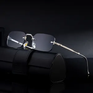 Gafas de sol sin montura 2025 con patillas de metal plateado y lentes grises de moda
