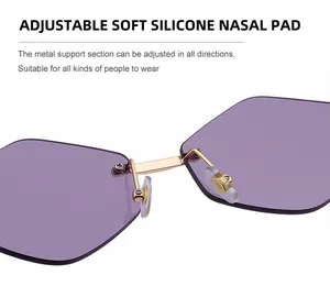 Detail of adjustable soft silicone nose pads on rimless purple geometric sunglasses