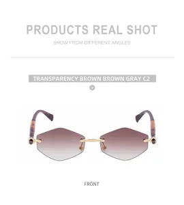 Front view of rimless geometric sunglasses with brown gradient lenses and tortoise temples