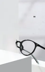 Detail of black oval full-rim eyeglass frames with polished finish and model KT62606