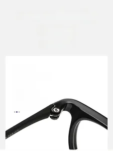 Macro shot of durable metal hinge and polished black frame on oval optical glasses