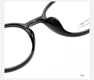 Macro shot of integrated comfortable nose pads on black oval optical glasses frames