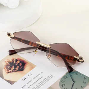 Fashion rimless hexagonal gradient brown sunglasses with gold metal accents and tortoiseshell arms