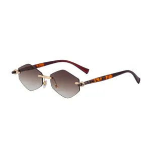 Fashionable rimless sunglasses for women with brown gradient geometric lenses and gold bridge