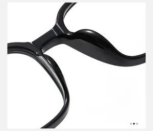 Detail of ergonomic integrated nose pads on black glossy frames for a comfortable fit