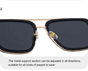 Détail des plaquettes de nez en silicone réglables et du pont en métal doré des lunettes de soleil