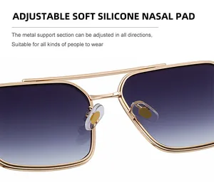 Detail of adjustable soft silicone nose pads on gold metal square sunglasses frames