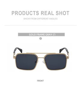 Detailed front shot of gold metal double bridge square frame sunglasses with gray lenses