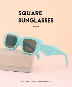 Détail de lunettes de soleil carrées vert menthe avec branches larges et verres UV400