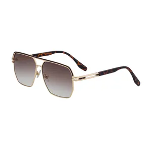 Moderne quadratische Pilotensonnenbrille mit goldener Metallbrücke und Verlaufsgläsern