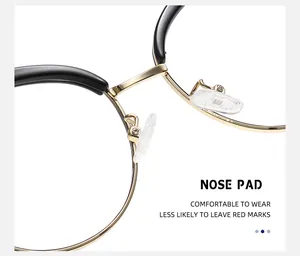 Detalle de almohadillas nasales transparentes con soporte de metal dorado en gafas de gato