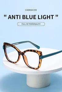 Detail of tortoiseshell cat-eye frames with teal arms and anti-blue light lenses