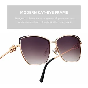 Détail des lunettes de soleil œil-de-chat avec monture en métal doré et verres dégradés