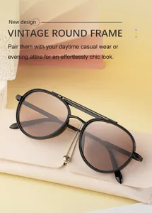 Lunettes de soleil ovales rétro avec double pont en métal noir et verres marron clair et étui