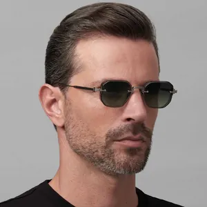 Side view of male model wearing retro octagonal sunglasses with green gradient lenses